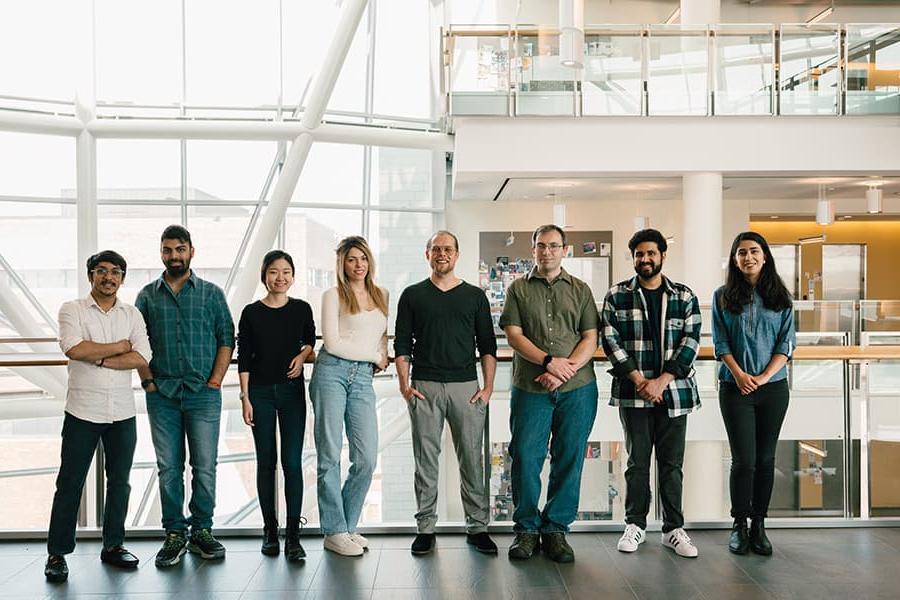 UMass Boston researchers pose for a photo.